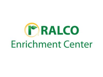 Logo with a green letter "R" featuring a leaf inside a yellow circle, followed by the words "RALCO Enrichment Center" in green text on a white background.