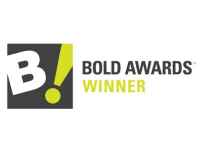 Logo featuring a large white "B!" on a dark square background, with the text "BOLD AWARDS WINNER" in black and yellow to the right.