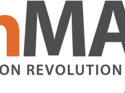 Logo for “EnMAX Nutrition Revolution.” “En” is in orange, “MAX” is in gray with an orange lightning bolt forming part of the “X.” “Nutrition Revolution” is written in gray below the brand name.