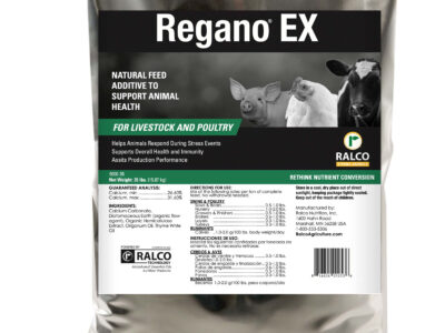 A silver bag of Regano EX natural feed additive for livestock and poultry by Ralco, featuring images of a piglet, chick, and cow, with product details and directions printed on the front label.
