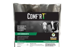 A silver bag labeled "COMFRT" features images of two cows and text indicating it is a feed additive for ruminants by Ralco, designed to help manage environmental challenges and support animal health.
