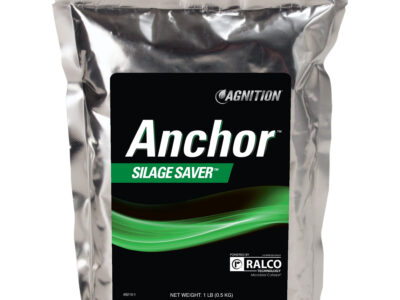 A silver, sealed bag labeled "Agnition Anchor Silage Saver" with a green and black design and a Ralco logo, indicating a net weight of 1 lb (0.45 kg).