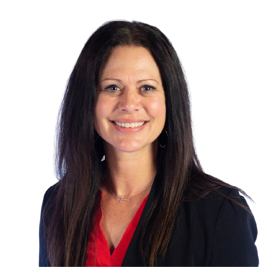 Smiling woman with long dark hair wearing a black blazer over a red top, posing against a plain white background.