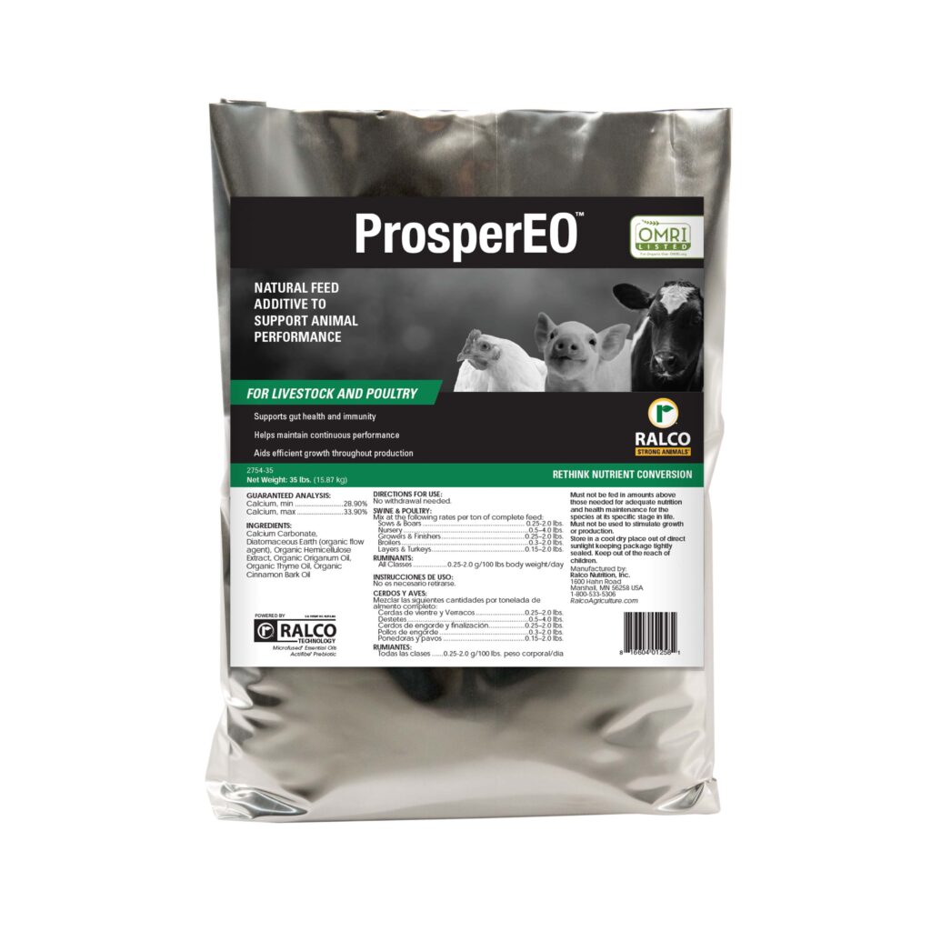 A silver ProsperEO feed additive bag displays a pig, chicken, sheep, and cow. The packaging highlights benefits for livestock and poultry, product details, and nutrition facts.