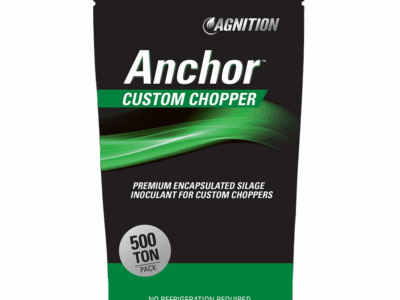 A black and green 500-ton pack labeled “Anchor Silage Custom Chopper,” marketed as a premium encapsulated silage inoculant for custom choppers. The packaging notes “No Refrigeration Required.”.