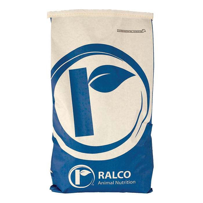 A large white and blue bag labeled "Birthright Bridge" with a circular leaf logo, used for packaging animal feed or nutrition products.