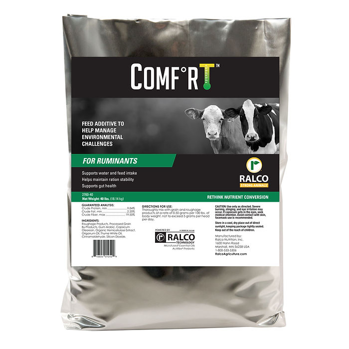 A silver package labeled "Comfort for Cow/Calf" features images of a cow and calf. It's a Ralco feed additive for ruminants that supports water and feed intake and helps manage environmental challenges.