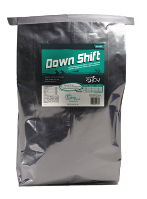 A large silver bag labeled "Down Shift" with teal and white text, described as a nutritional supplement for show livestock. The package includes detailed product information and feeding instructions.