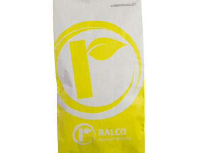 A white and yellow paper bag labeled "Essential DRY XP OMRI Listed" with a circular leaf logo near the top center.