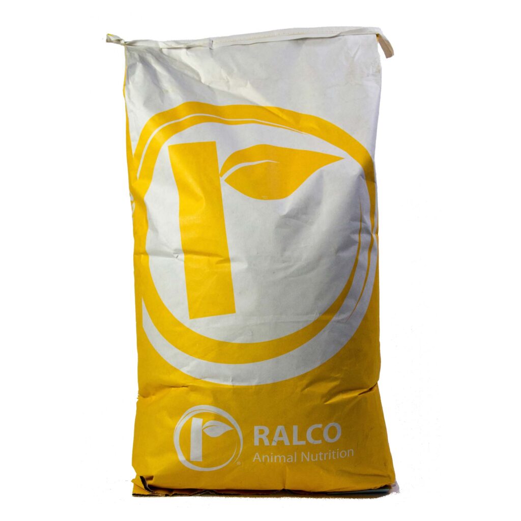 A large yellow and white bag labeled "Essential Dry XP" with a circular logo featuring a stylized leaf design on the front.