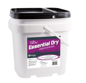 A white plastic bucket with a black lid labeled "Essential Dry" on a purple background, used as a horse feed supplement. The label displays the product name, details, and feeding instructions.