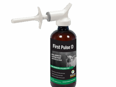A brown bottle labeled "First Pulse D" with a white oral applicator, designed for piglets as an oral drench to support appetite and vigor. The label shows a piglet image and features Ralco branding.