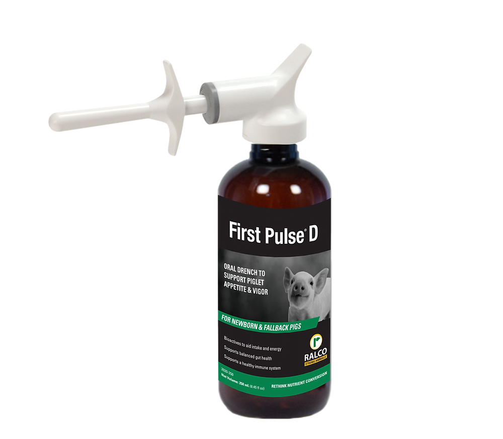 A brown bottle labeled "First Pulse D" with a white oral applicator, designed for piglets as an oral drench to support appetite and vigor. The label shows a piglet image and features Ralco branding.