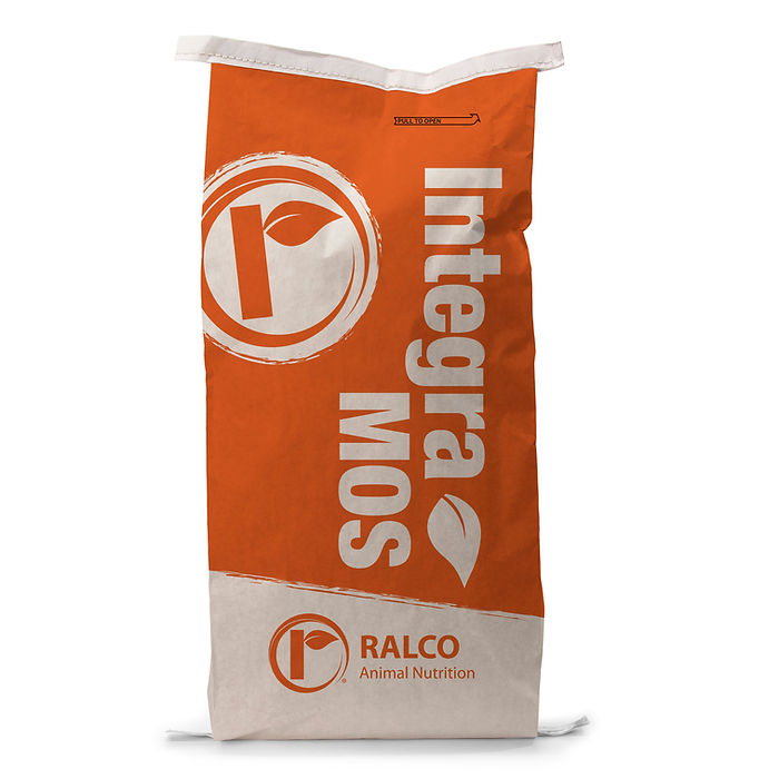 An upright, large orange and white IntegraMOS bag with a leaf logo and "RALCO Animal Nutrition" text at the bottom, plus a circular logo, stands on a plain white surface.