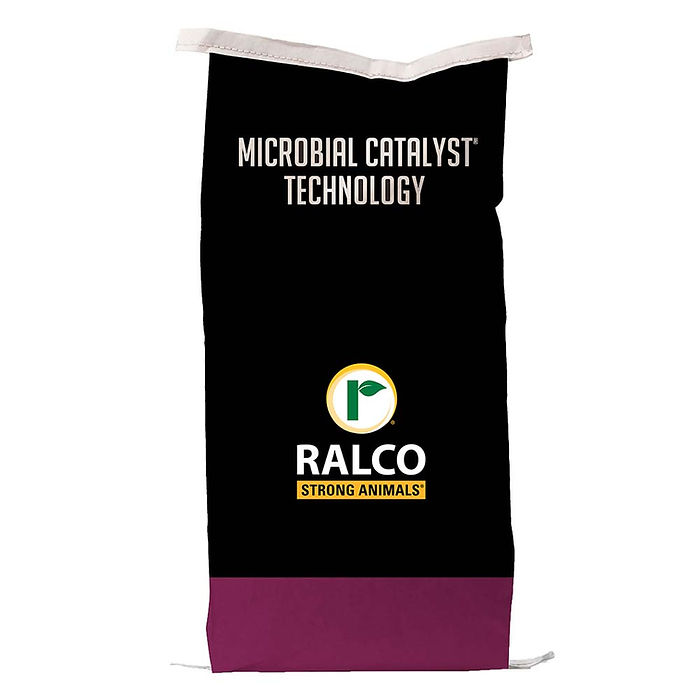 A black and purple MC100 for Cow/Calf feed bag with "MICROBIAL CATALYST TECHNOLOGY" and the "RALCO STRONG ANIMALS" logo, which displays a green leaf inside a yellow circle.