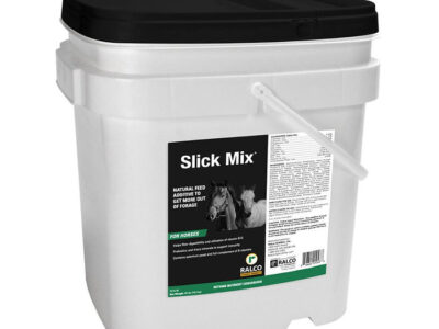 A white plastic container with black lid and handle, labeled "Slick Mix" natural horse feed additive. The label shows a horse image and product details in white and green text.