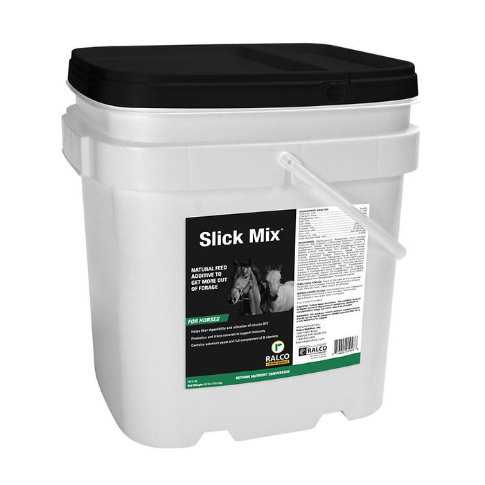 A white plastic container with black lid and handle, labeled "Slick Mix" natural horse feed additive. The label shows a horse image and product details in white and green text.