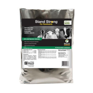 A silver bag labeled "Stand Strong for Ruminants OMRI Listed" by Ralco, featuring cows, sheep, and goats. Marketed as a natural feed additive for ruminant health and suitable for continuous feeding.