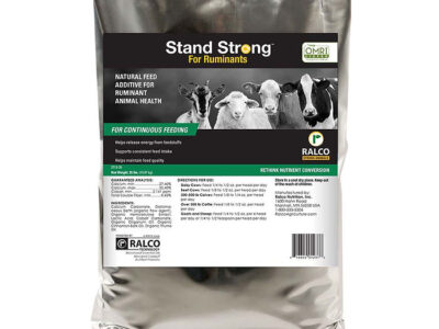 A silver bag labeled "Stand Strong for Ruminants OMRI Listed" by Ralco, featuring cows, sheep, and goats. Marketed as a natural feed additive for ruminant health and suitable for continuous feeding.