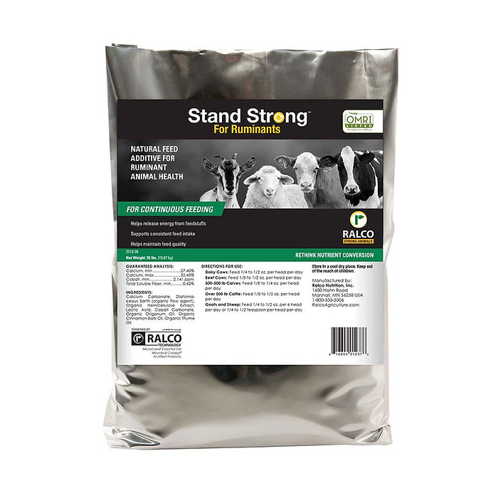 A silver bag labeled "Stand Strong for Ruminants OMRI Listed" by Ralco, featuring cows, sheep, and goats. Marketed as a natural feed additive for ruminant health and suitable for continuous feeding.