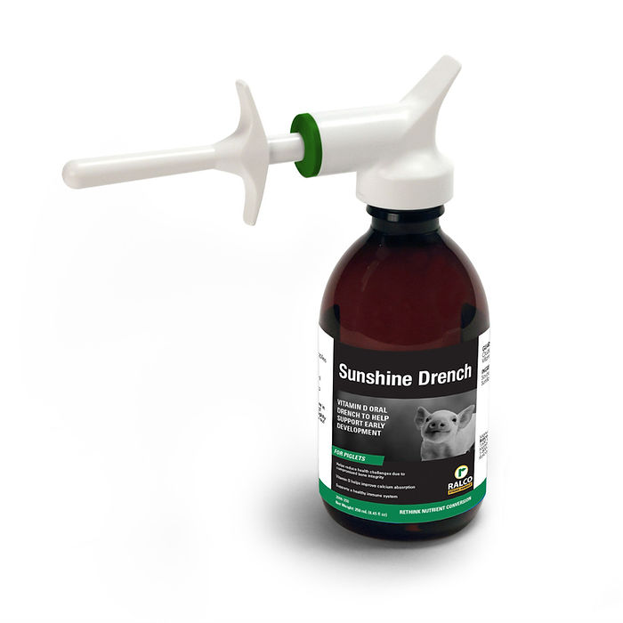 Sunshine Drench comes in a brown bottle with a white and green dosing syringe, features a goat on the label, and provides vitamin D benefits to support healthy development in pets.