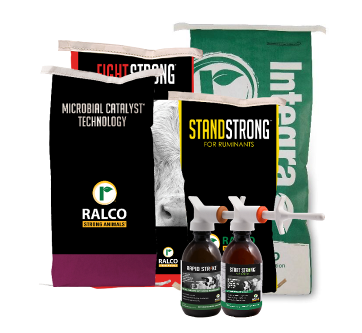 Four animal nutrition product packages from Ralco are displayed, including two black bags labeled "Fight Strong" and "Stand Strong," a green and white Integra bag, and two bottles with pump dispensers labeled "Rapid Strike" and "Start Strong.